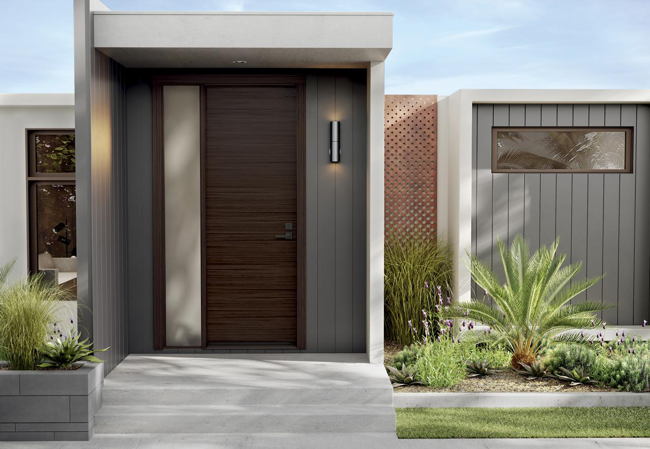 Double entry doors in matte black with frosted glass inserts, enhancing the curb appeal of a luxury residence.
