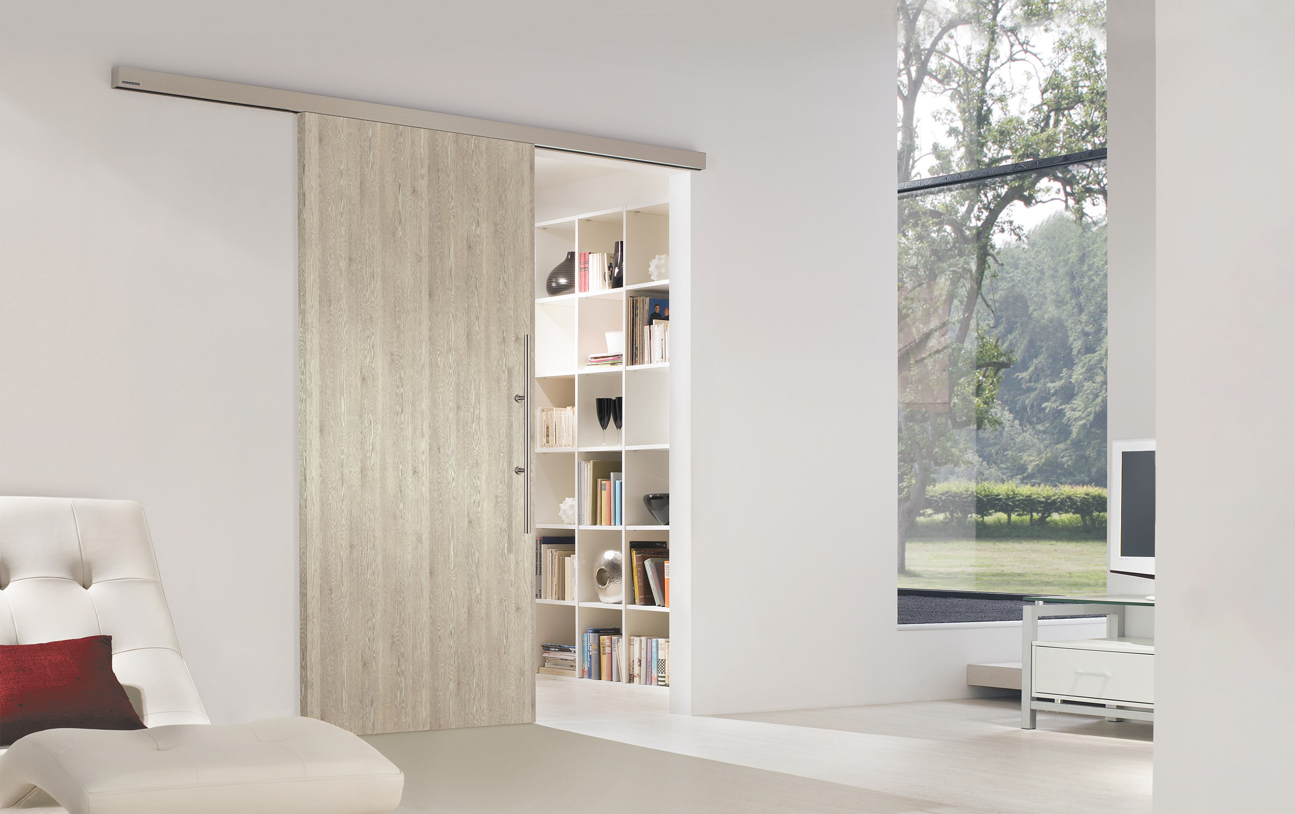 Close-up of a glass sliding door with a minimalist design and natural light pouring through.