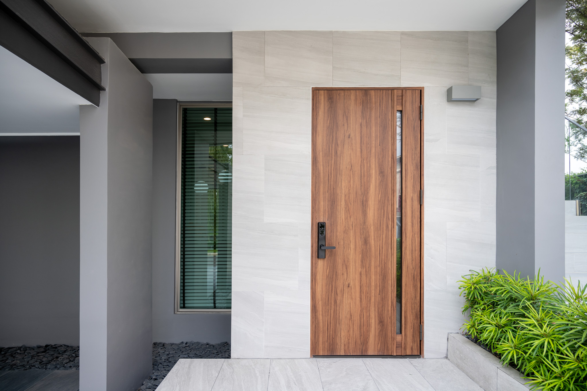 Custom wood entry door featuring classic raised panel design.